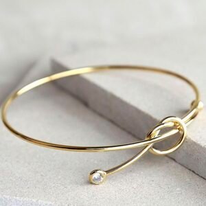 RÉVÉLIAA 18K Gold Bezel Diamond Knot Bangle